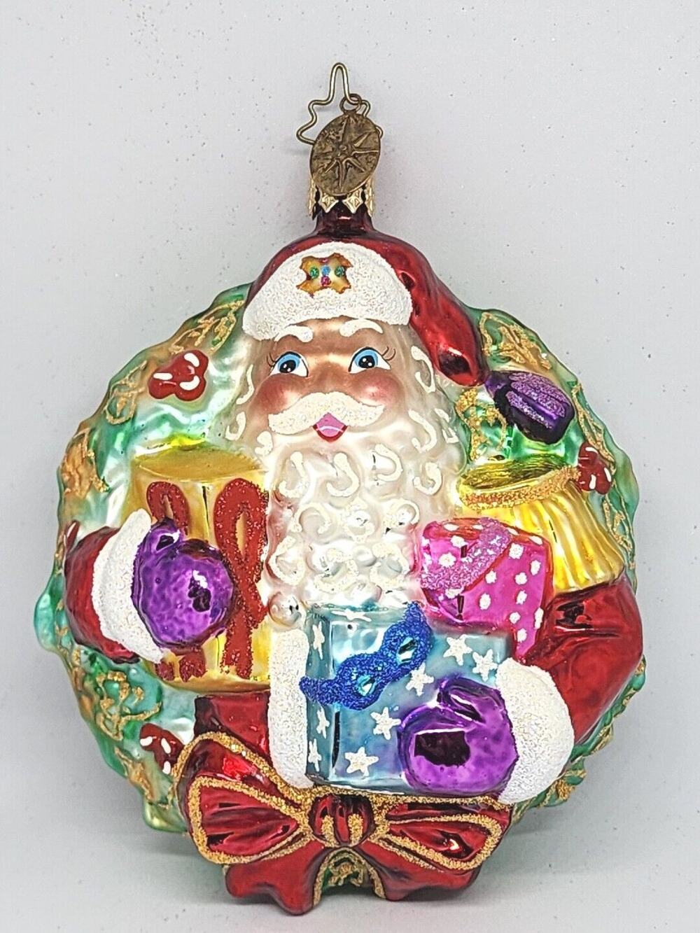 Christopher Radko A Gift For Giving Santa Wreath Glass Christmas Ornament 5”